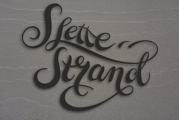Slettestrand logo on the sand
